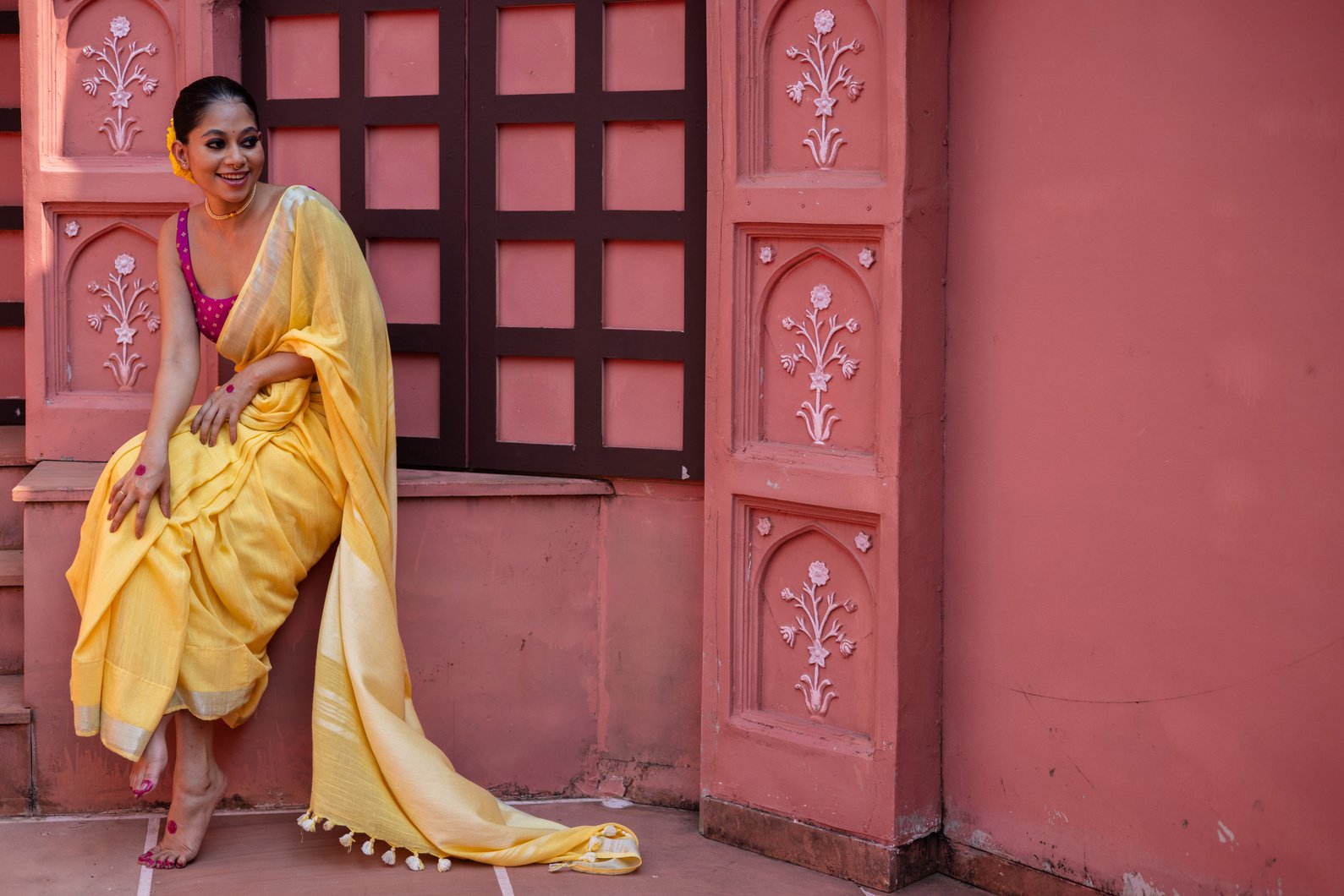 Sitting Woman Wearing a Saree