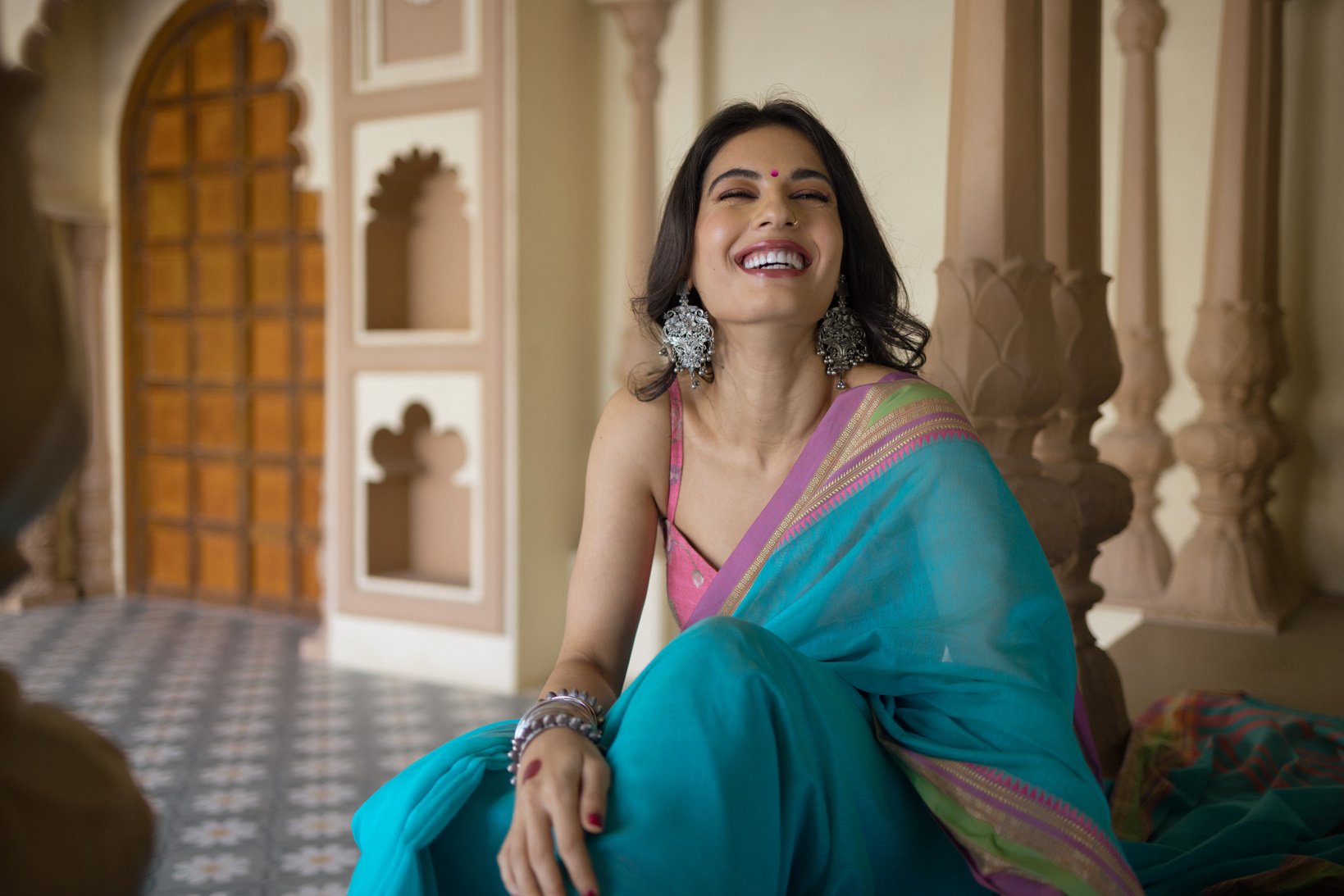 Sitting Woman Wearing a Saree